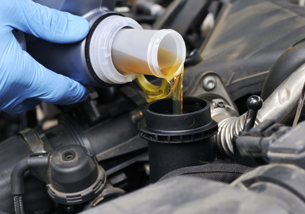 Oil change Mechanic doing an oil change on a car